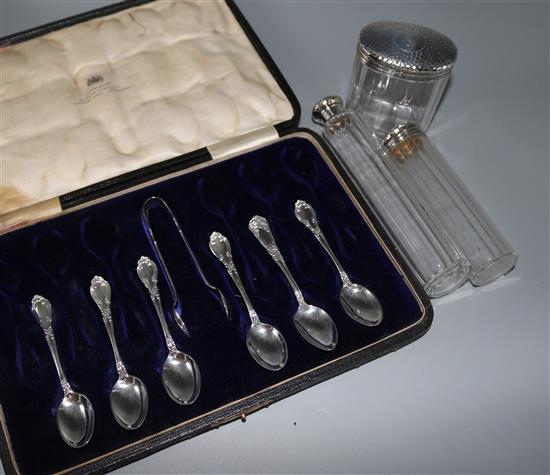 Six silver coffee spoons, pair of sugar tongs and three silver mounted toilet jars.